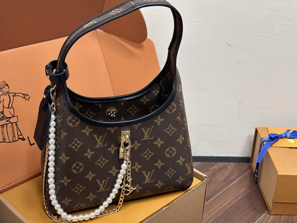 Drop PM Handbag – Monogram Canvas with Gold Padlock Accent